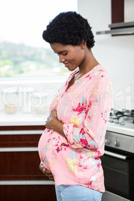 Pregnant woman touching belly