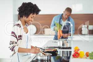 Happy couple preparing meal