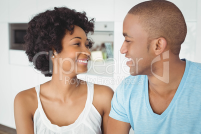 Smiling couple looking at each other