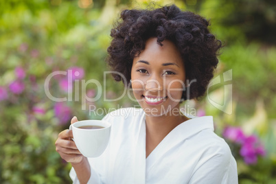 Smiling woman holding mug