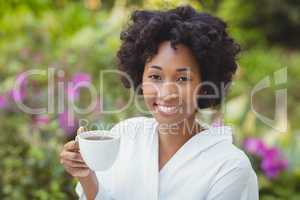 Smiling woman holding mug