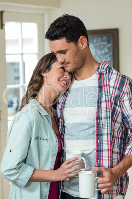 Happy couple having a cup of coffee