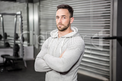 Confident man standing with arms crossed