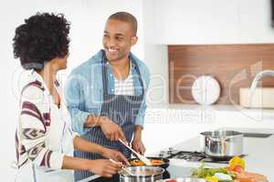 Happy couple cooking together
