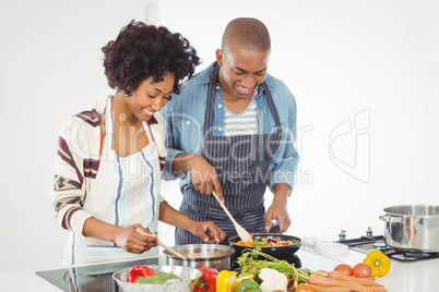 Happy couple cooking together