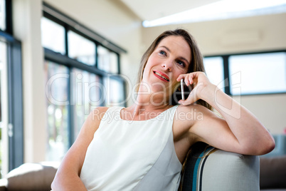 smiling woman talking on her mobile phone