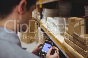 Warehouse worker scanning box