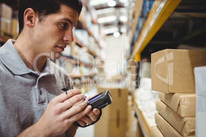 Warehouse worker scanning box