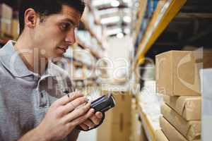 Warehouse worker scanning box