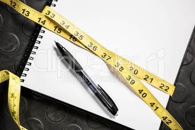 Notepad and measuring tape