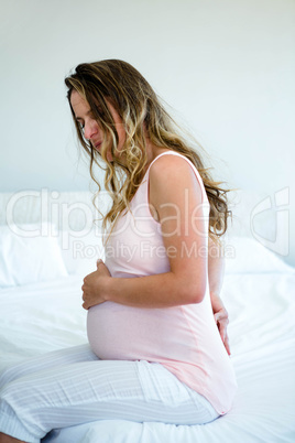 unhappy pregnant woman in discomfort