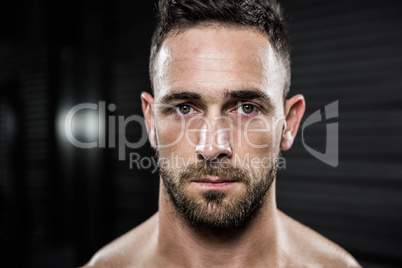 Portrait of shirtless man looking at the camera