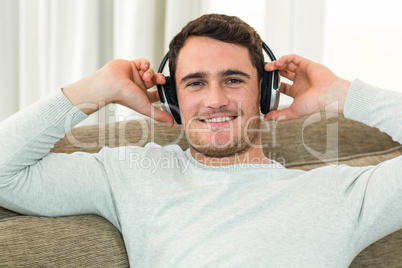 Portrait of young man listening to music