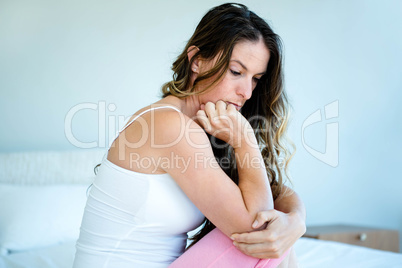 anxious woman with her head in her hands