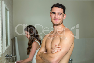 Couple in front of bathroom mirror