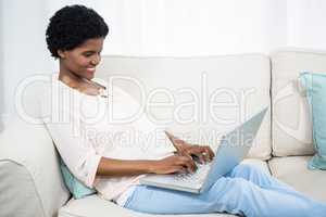 Pregnant woman using laptop