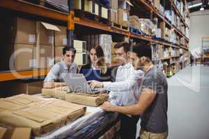 Portrait of smiling warehouse managers