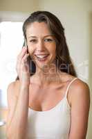 Close-up of young woman talking on mobile phone
