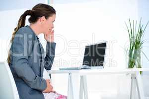 pregnant business woman sittting at her desk