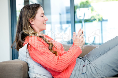 smiling woman on her tablet