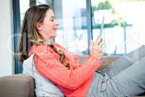 smiling woman on her tablet