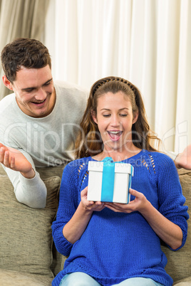 Woman receiving a surprise gift