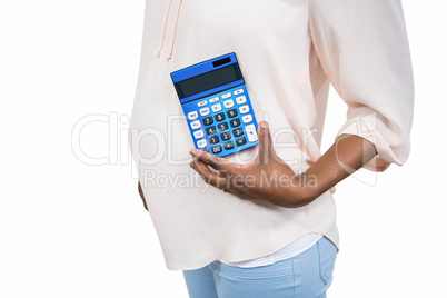 Pregnant woman holding calculator