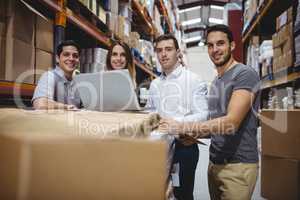 Portrait of smiling warehouse managers