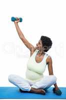 Pregnant woman exercising with dumbbell