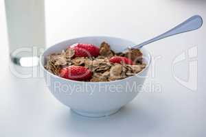 View of cereals and glass of milk