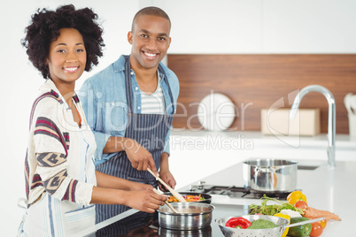 Happy couple cooking together