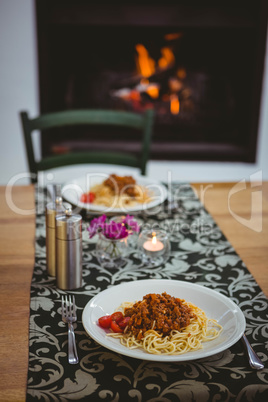 Plates of spaghetti on table