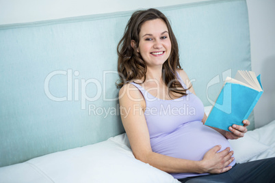 Pregnant woman reading a book