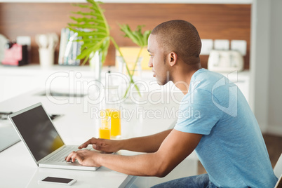 Young man using laptop