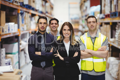 Portrait of warehouse manager and workers