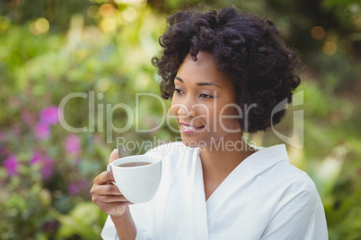 Smiling woman holding mug