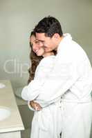Young couple embracing in bathroom