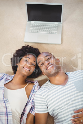 happy couple lying on the floor