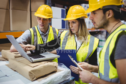 Portrait of smiling warehouse managers