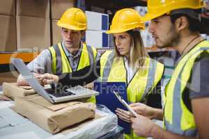 Portrait of smiling warehouse managers