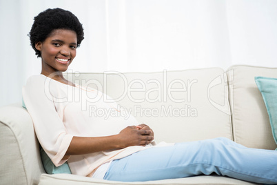 Pregnant woman relaxing on couch