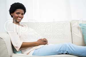 Pregnant woman relaxing on couch