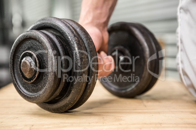 Close up of man holding dumbbell