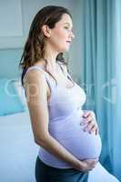 Pregnant woman touching her belly