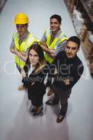 Portrait of warehouse manager and workers