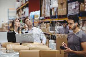 Portrait of smiling warehouse managers