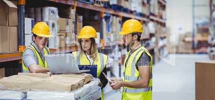 Portrait of smiling warehouse managers