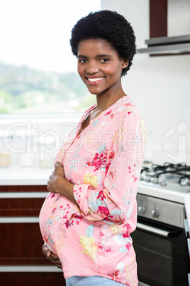 Pregnant woman touching belly