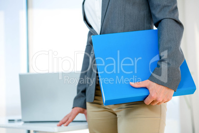 business woman carrying a folder