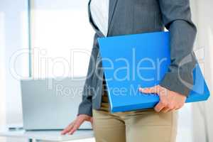 business woman carrying a folder